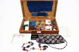 A wooden jewellery box and contents.