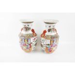 Pair of Chinese republic porcelain vases. With polychrome enamel decoration of figures and flowers.