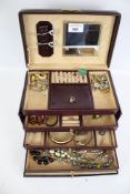 A collection of vintage costume jewellery in a lockable leather jewellery box