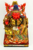 A 20th century Chinese carved and painted warrior figure.