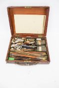A mahogany artist's paint box and contents