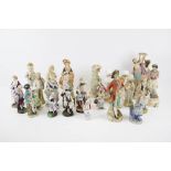 A collection of assorted continental bisque porcelain figures. Approximately twenty eight. Max.