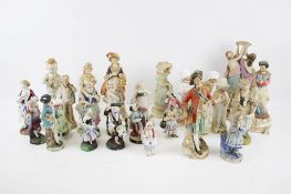 A collection of assorted continental bisque porcelain figures. Approximately twenty eight. Max.