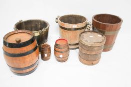 A collection of vintage buckets and barrels.