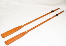 A pair of wooden boat oars.
