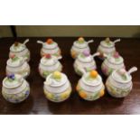 Twelve Franklin Mint ceramic jam pots.