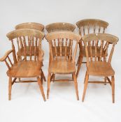 A true set of 6 (5+1carver) pine kitchen chairs with turned column splats