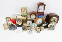 A quantity of 1950s clocks (mostly bedside) and a contemporary cased brass sun compass