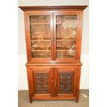 A Victorian and later glazed top dresser.