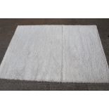 A Domino modern white rug, 200cm x 290cm.