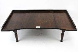A British mahogany metamorphic tray with legs. Three sections, H25cm x W68.5cm x D40.