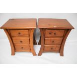 A pair of contemporary bedside cabinets.