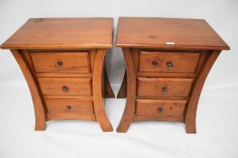 A pair of contemporary bedside cabinets.