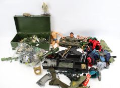 A collection of Action Man accessories. Including uniforms, a figure AF, equipment, etc.