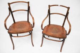 Two bent wood open armchairs.