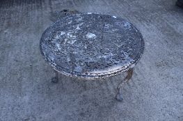 A cast aluminium low circular table.