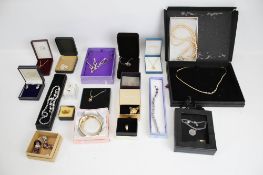 A collection of 20 boxes of assorted costume jewellery pieces