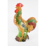 A polychrome ceramic cockerel.