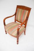 A contemporary fruitwood French Empire style open arm fauteille chair.