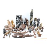A collection of assorted carved wooden items.