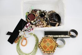 A mixed lot of costume jewellery. Including boxes, bangles, contemporary necklaces, etc.