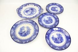 A collection of nine assorted blue and white plates.