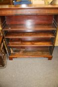A mahogany open bookcase fitted with three adjustable shelves. L103cm x D28cm x H117cm.