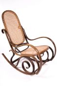 Vintage Retro : A stained beech wood rocking chair.