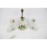 A pair of Staffordshire spaniels and a Derby style lamp base.