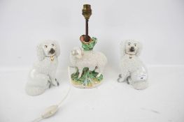A pair of Staffordshire spaniels and a Derby style lamp base.