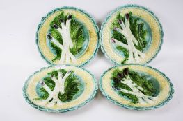 A set of four majolica pottery asparagus plates. Diameter 23.