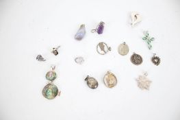 A collection of 15 silver and white metal pendants including amethyst