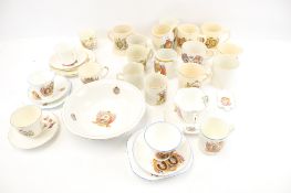 A collection of commemorative mugs and ceramics.