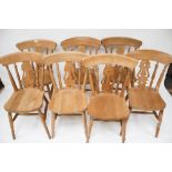 A set of seven pine kitchen chairs.