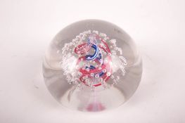 A Whitefriars glass paperweight.