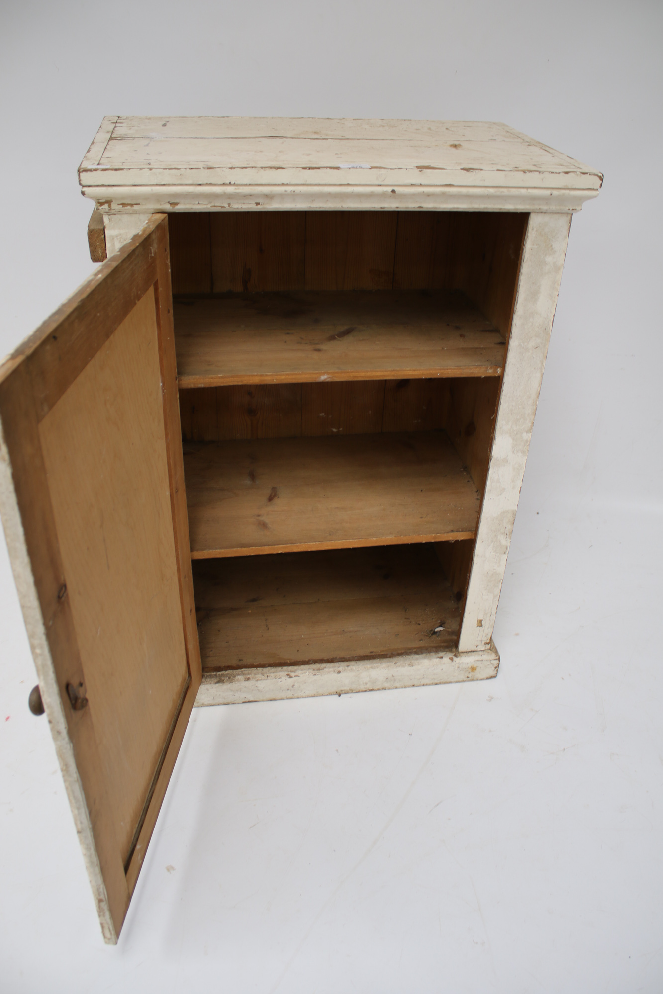 A vintage white painted pine cupboard. With a single door and two shelves, L66cm x D40. - Image 2 of 2