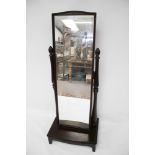 A Stagg dark stained Cheval full length dress mirror on stand.