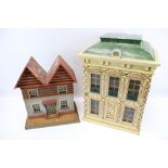 Two vintage dolls houses.