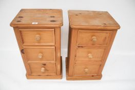 A pair of pine bedside tables.