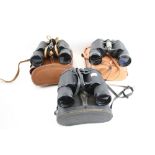 Three pairs of vintage binoculars cased. Including Prinz 10 x 50, Halina 10 x 50 and Zenith 16 x 50.