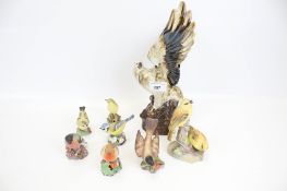 A collection of eight assorted china bird figurines. Including seven Royal Worcester plus an eagle.