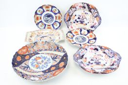 Five Imari dishes. Including a pair decorated with birds, diameter 21.