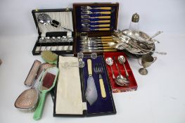 A collection of silverplated and other items.
