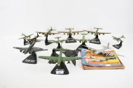 A collection of twelve assorted diecast model military aircraft.