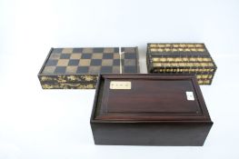 Two wooden boxes and a Chinese chinoserie decorated chess and backgammon board.