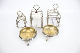 Three small toast racks and two Victorian salts
