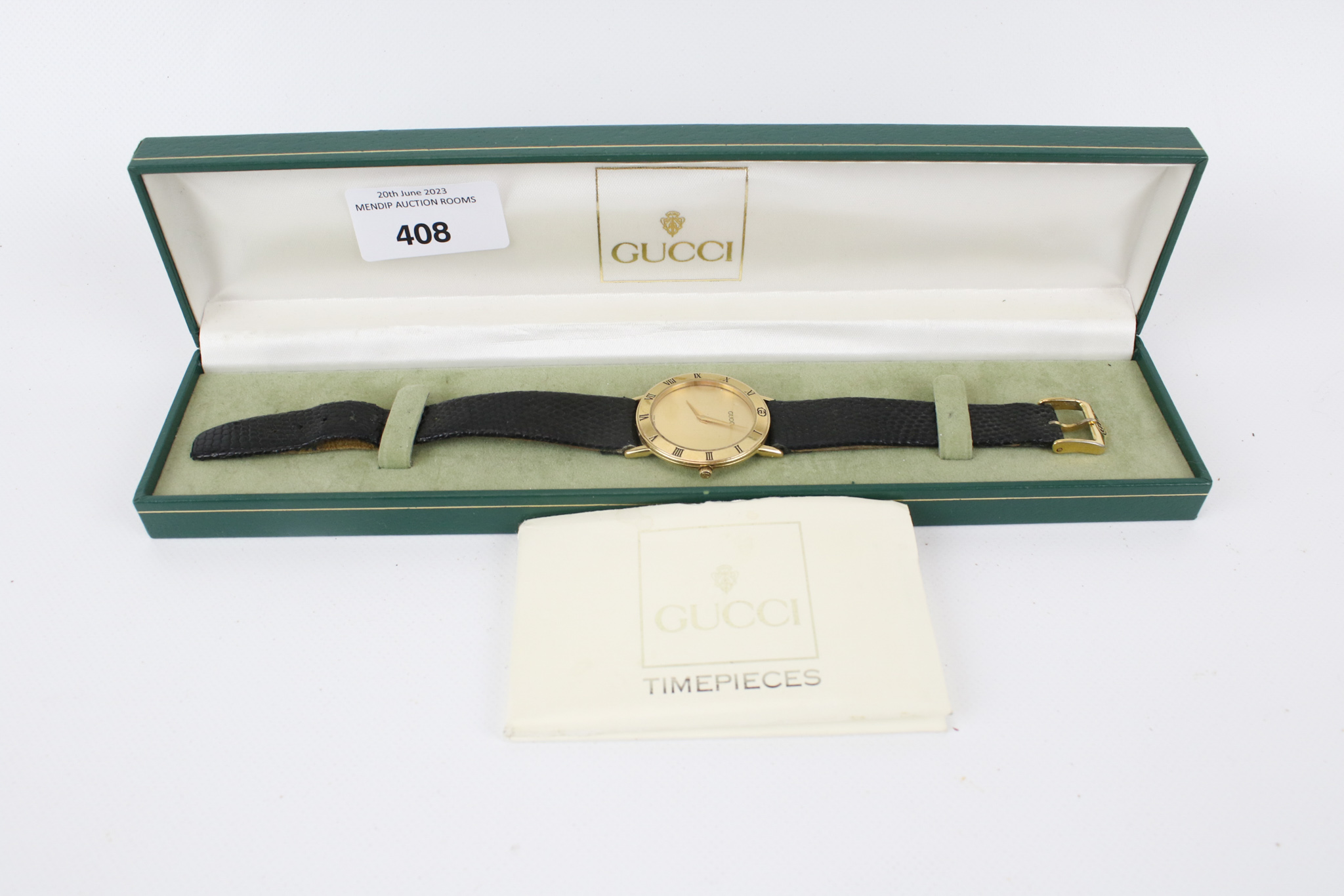 An early 1990s Gucci 3000.2.M gents quartz dress watch in original box with paperwork.