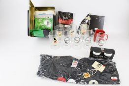 A group of assorted Guiness collectables. Including advertising glasses, a mug, etc. Max.