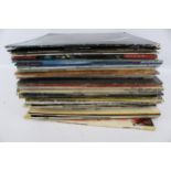 A collection of assorted vinyl LP 33 RPM records. Including mostly jazz and 1960s rock, etc.