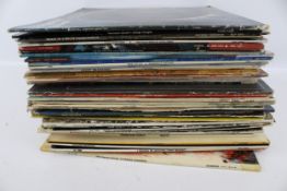 A collection of assorted vinyl LP 33 RPM records. Including mostly jazz and 1960s rock, etc.